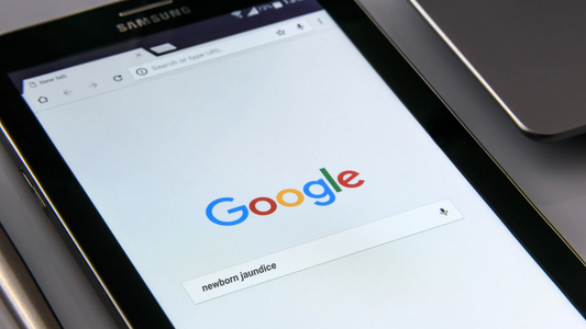 Google search for newborn jaundice displayed on a tablet screen.